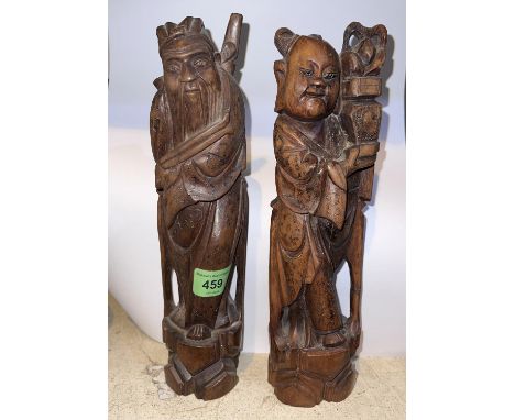 A pair of Chinese carved wooden figures of male and female figures inlaid with thin silver strips, height 28cm 