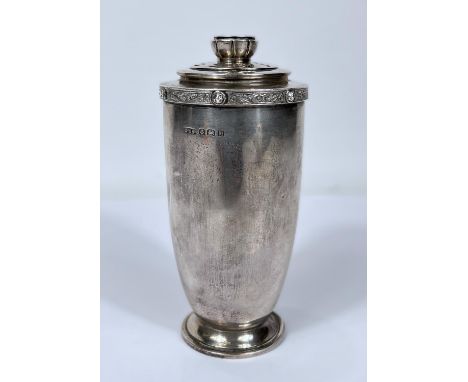 A hallmarked silver sugar dredger of tapering form with Celtic rim, Birmingham 1926, 5oz