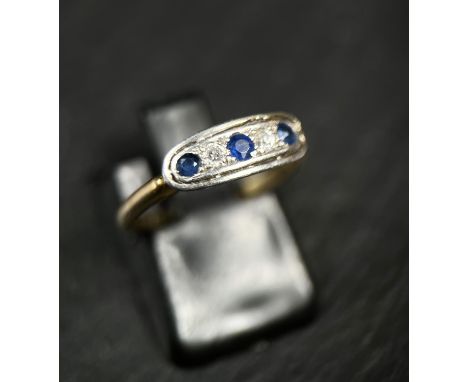 An Art Deco 'gypsy' style ring set 3 sapphires and 2 old cut diamonds, stamped 18ct, 2.5gm size L 