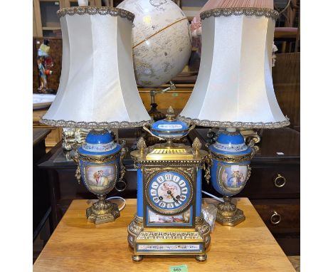 A Sèvres style clock garniture in porcelain and ormolu, with central clock and 2 side urns/table lamps