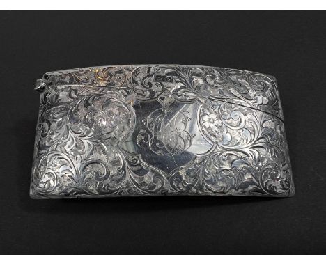 A card case, Edwardian silver, of curved rectangular form with floreate chasing, Birmingham, 1909 