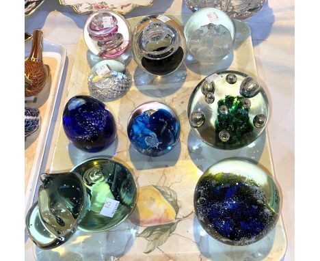 A collection of 9 modern glass paperweights by Caithness; Mdina; etc. 