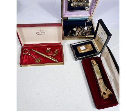 A Dunhill lighter, boxed; an onyx and gilt cigar cutter; a pen and cufflinks presentation set; other cufflinks; etc. 