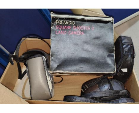 A poleroid camera; other cameras and equipment; old projectors; etc. 