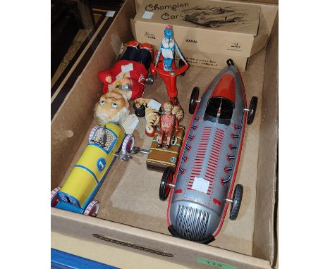 A vintage clockwork half tinplate barman with cocktail shaker, a vintage tinplate bellboy on&nbsp; &nbsp; other later tinplat