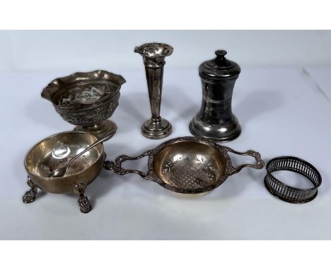 A hallmarked silver tea strainer on stand; a hallmarked silver pepper grinder; glass salt; etc., 6.4oz gross