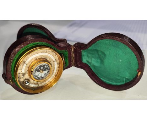A BAROMETER COMPENDIUM, aneroid movement with altimeter, thermometer and compass, 50mm diameter in double opening case 