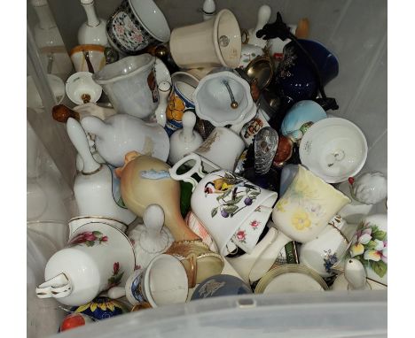 A large collection of ceramic and glass decorative bells 
