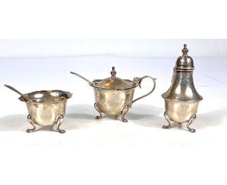 A hallmarked silver cruet:&nbsp; mustard, salt and pepper, with spoons, Birmingham 1944, 3oz 