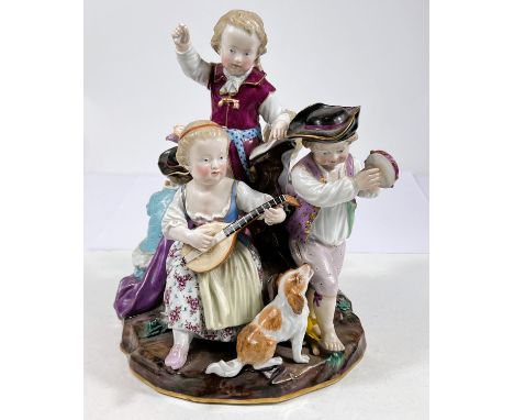 A 19th century Meissen group of children in 18th century dress playing musical instruments, model B24, ht. 27cm, cross sword 