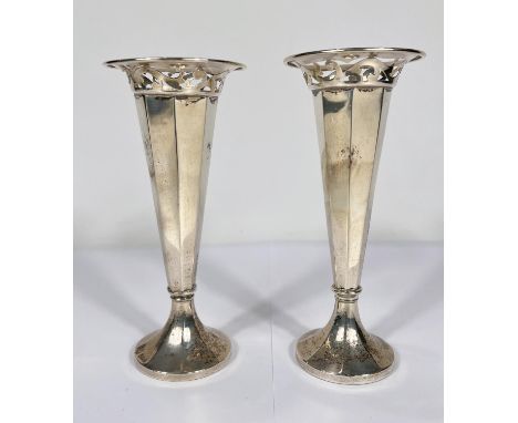 A hallmarked silver pair of specimen vases of tapering pierced form, on weighted bases, Birmingham 1939, height 17cm (some de