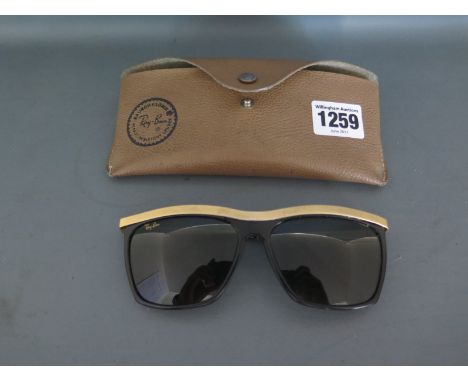 A pair of vintage USA made Rayban W0741 Olympian III sunglasses in ebony and gold - a hard to find model - gold Rayban logo o