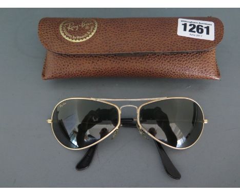 A pair of vintage USA made Rayban W2614 matt gold G15 Air Boss Orb wrap around Aviator sunglasses, gold logo to lens, B & L o