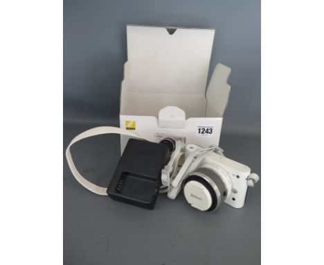 A Nikon I digital camera - boxed with battery charger