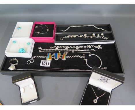 A collection of silver bracelets, necklaces and a scarf clip - all wearable condition