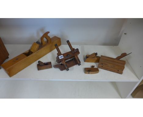 Six vintage planes including a vintage smoothing plane, a plough, grooving plane, a bull nose plane and two others