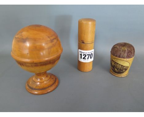 A collection of three pieces of 19th century boxwood treen including a globe case, Mauchline ware pin cushion and medicine fl