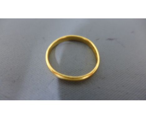 A 22ct gold band ring - approx weight 1.9 grams - ring size K/L