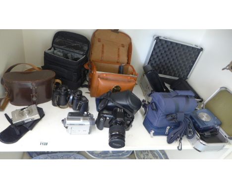A Canon EOS 500 camera, a Canon photo card printer, a pair of binoculars and other photographic items