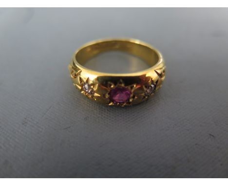 An 18ct yellow gold diamond and ruby ring size Q - approx weight 7.3 grams - ruby has small abrasions, shank has light surfac