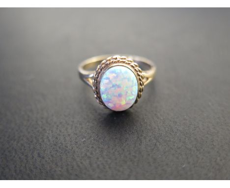 A 9ct yellow gold oval opal dress ring size N/O - approx weight 3.3 grams - surface scratches, light usage wear