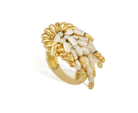 A GOLD AND FRESHWATER PEARL RINGOf bombé design with fluted detailing, centring a freshwater pearl cascade with textured gold