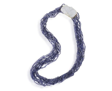 A BEAD AND JADE NECKLACEComposed of eleven graduated rows of facetted purplish-blue beads (possibly tanzanites) with cultured