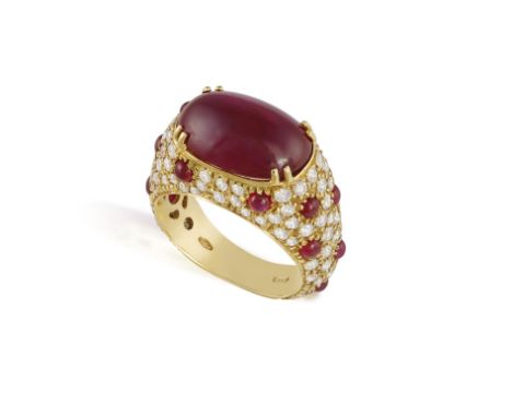 A RUBY AND DIAMOND DRESS RINGThe central oval-shaped ruby cabochon weighing approximately 7.80cts total, within a double four