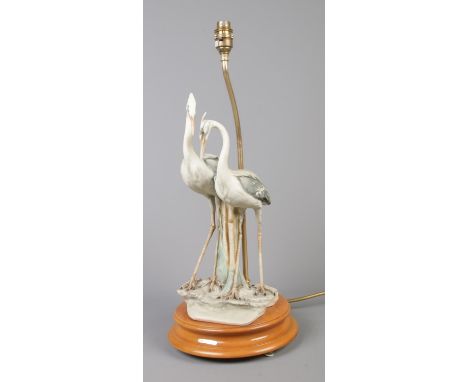 A Capodimonte porcelain table lamp formed as a pair of herons, R. Pennati. Impressed mark of 'Florence, 1984' to the base.  