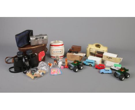 A small box of miscellaneous. To include red ground rug, Wade Scotch Whiskey Barrel, boxed Corgi die-cast vehicles and a case