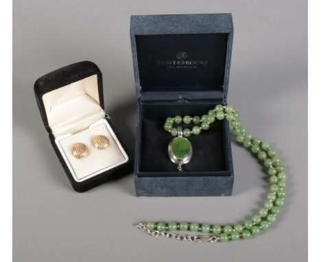 A jade coloured beaded necklace with silver and jade coloured pendant, together with a pair of yellow metal earrings with 9ct