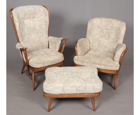 A pair of Ercol spindle back armchairs along with a matching footstool.  