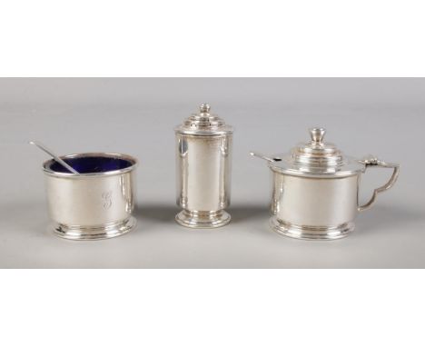 A Silver hallmarked cruet set with two mustard spoons. Assayed in London 1934 by James Henry &amp; Herbert Barraclough. Spoon