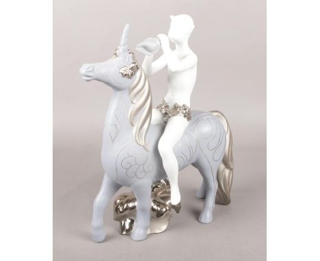 A Lladro limited edition ceramic figure group, Faun and Unicorn. Height 29.5cm.  Good condition.