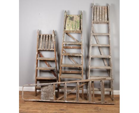 Four vintage graduated step ladders. (Tallest 193cm)  