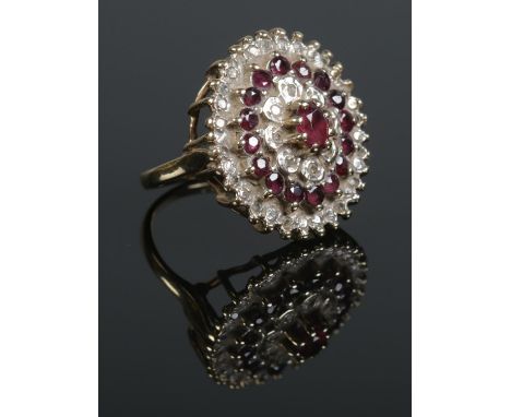 A vintage 9ct gold ruby and diamond cluster ring. Assayed for Birmingham 1979. Size O. 6.34g.  