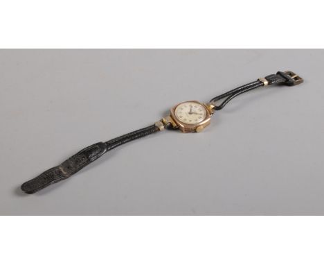 A ladies Rolex Marconi 9ct manual wind wristwatch, with arabic numeral dial enscribed 'James Walker'. On thin black leather s