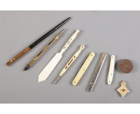 A collection of bone stanhopes, depicting Dieppe, Lourdes etc. together with white metal cased pencil, fountain pen and Loyal