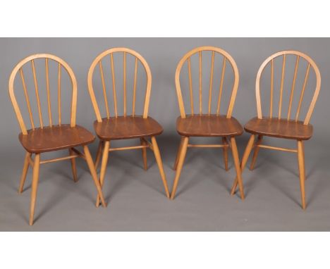 A set of four Ercol spindle back dining chairs.  