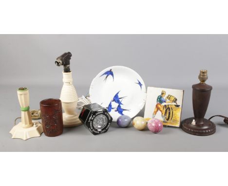 A small selection of collectables. To include three bakelite desk lamps, Onyx egg, carved wooden cup and Dutch tile etc.  