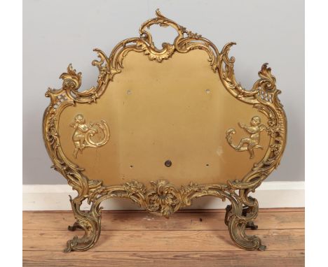 A gilt/brass fire screen. H:71cm W:69cm.  
