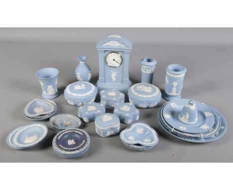 A collection of blue Wedgwood jasperware. Includes clock, vases, trinket boxes etc.  