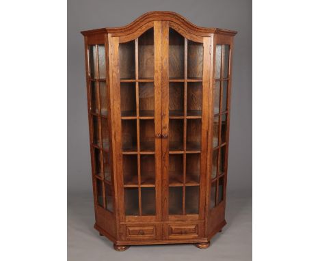 A large oak display cabinet with glass panel doors and two drawer base. (198cm x 130cm)  