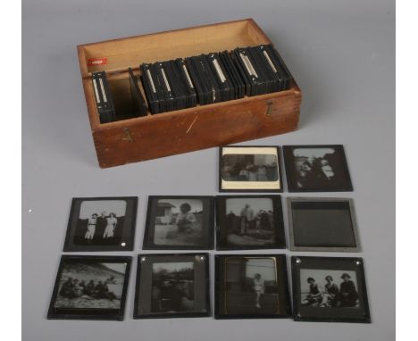 A box of magic lantern slides depicting family photos etc. Approx. 50+.  