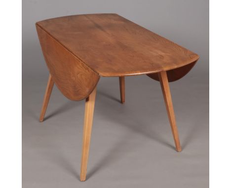 An Ercol drop leaf dining table.  