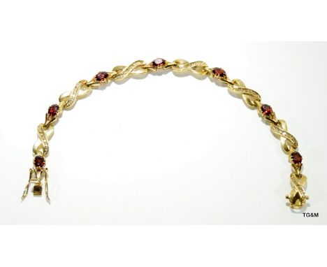 9ct gold ladies diamond and garnet line bracelet hallmarked