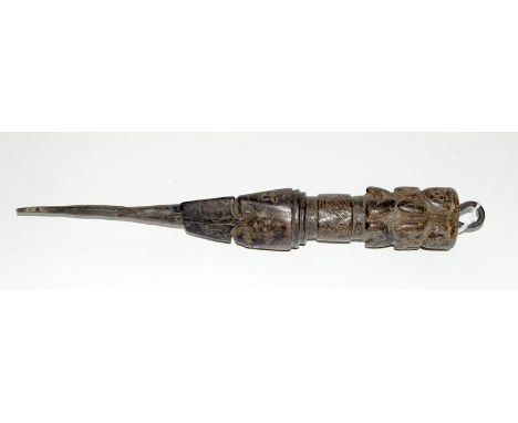 An early Tibetan carved wooden Phurba dagger. The handle being profusely carved with figures and faces. 34cms long overall