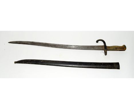 A French model 1866 Chassepot bayonet it its steel scabbard. Blade length 57cms