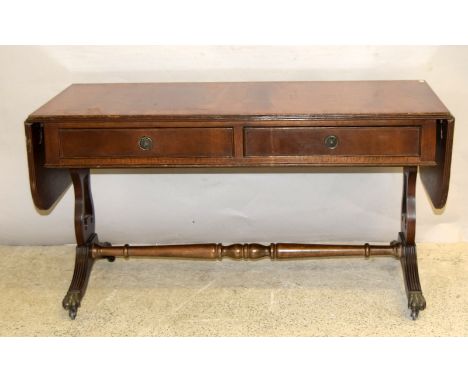 Mahogany sofa table with brass claw feet. 54 x 154 x 45cm