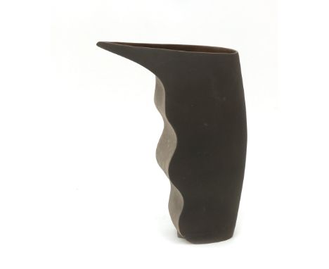 Yvonne Kleinveld (1952) A  grey and brown ceramic vase, part of a series of which another shaped vase could be placed against